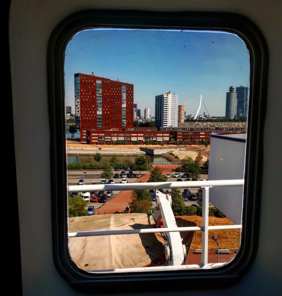 View of the Rotterdam skyline from the SS Rotterdam, a former cruise ship now permanently moored in the port city.