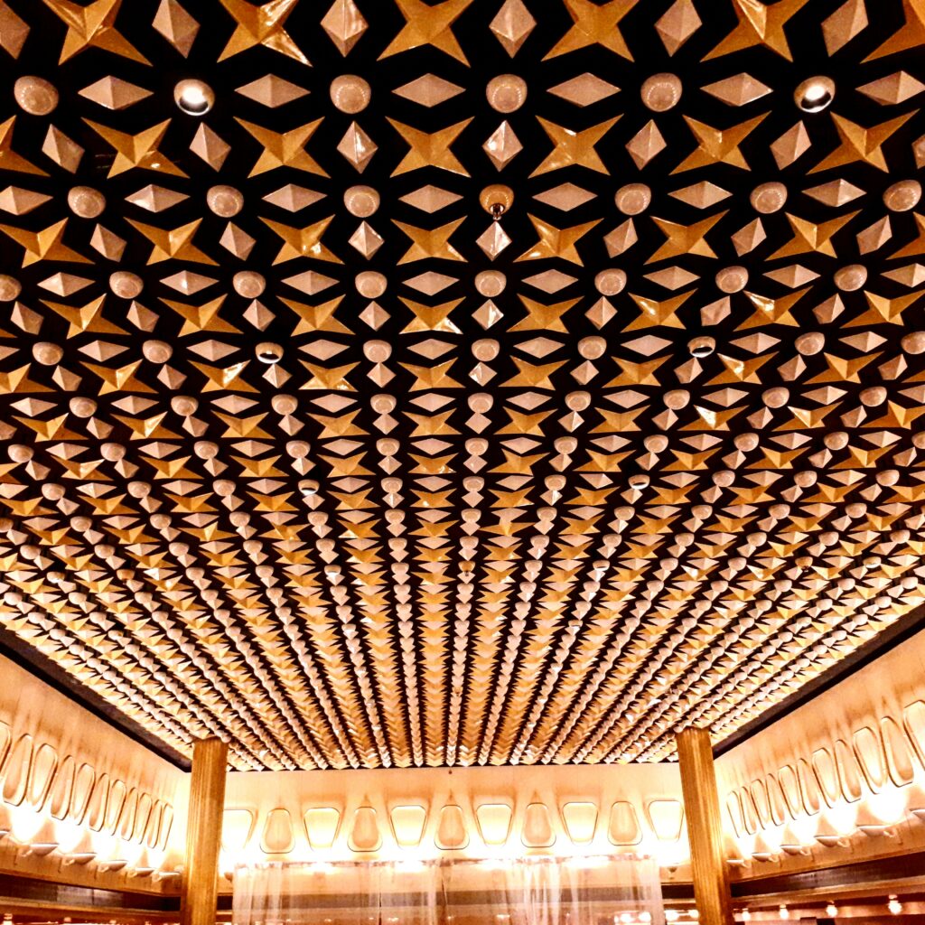 Stay on a former cruise ship in Rotterdam. This is a image of one of the ceilings in a reception room on the SS Rotterdam.