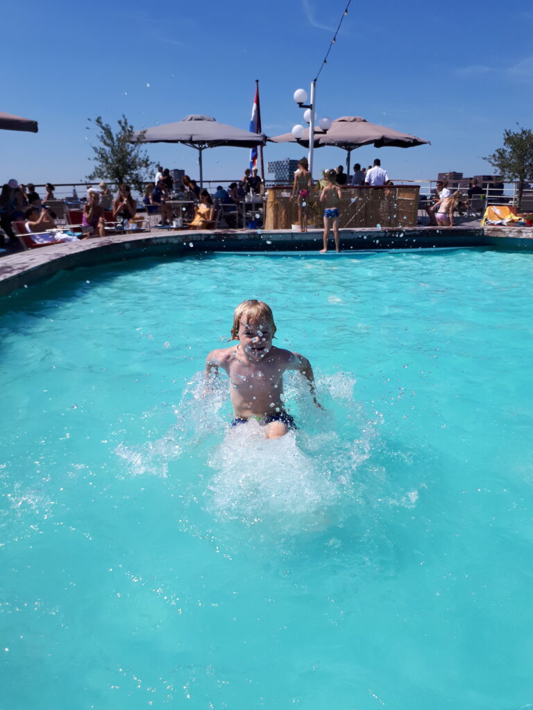 The SS Rotterdam, a former cruise ship in Rotterdam, has an inviting splash pool on the upper deck.